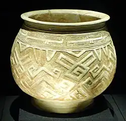 Light-coloured pot decorated with geometric designs