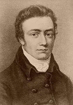 Head and shoulders etching of a young man in a high collar and buttoned coat. He is looking at the viewer.