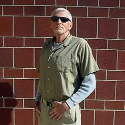 Lane posing in front of a brick wall