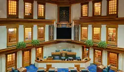 The state flag overlooking the State Building Senate Chamber. The floor carpet design is based on the state flag.