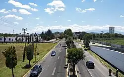 Aerial photograph looking down a long highway