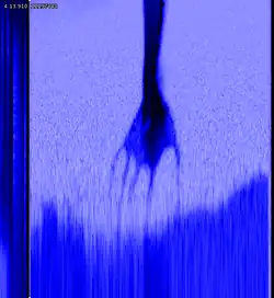 image of a blue arm and hand over white, pixelated dots